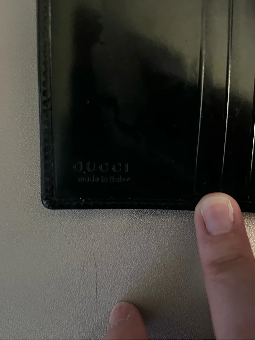 Gucci Black Patent Leather Bi-Fold Wallet with Embossed G